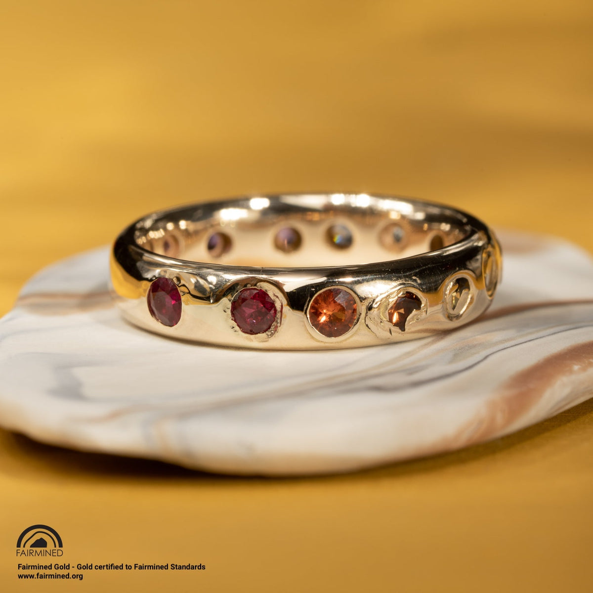 Malleable's rainbow Kimberlite gold ring with multiple stones