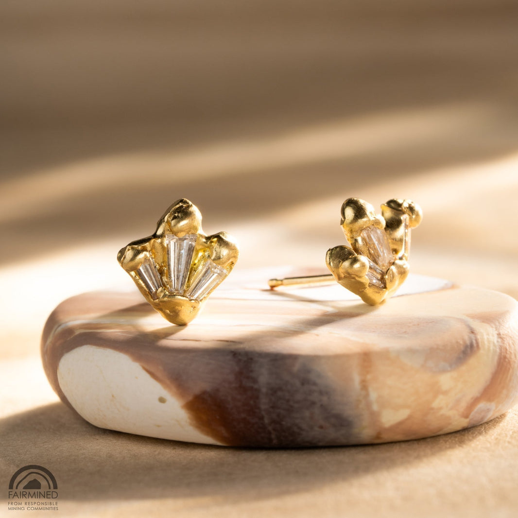 A pair of stud earrings - diamonds in gold using Malleable's Kimberlite technique