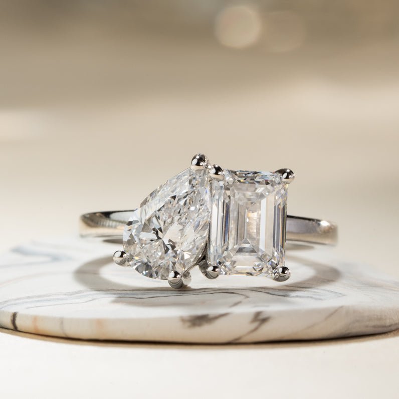 A photo of a Malleable diamond ring on a marble display plate. 
