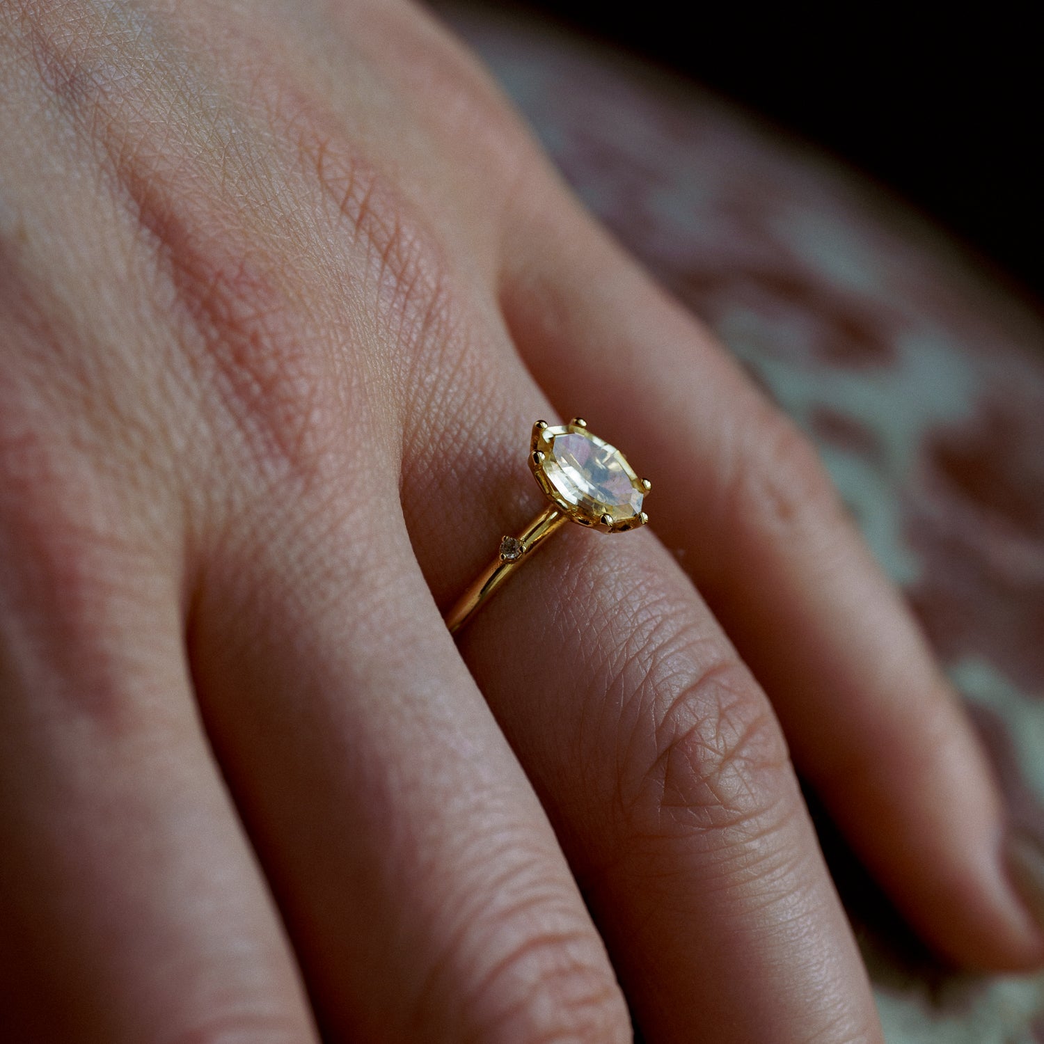 Sunrise Ring in Fairmined Yellow Gold with Portrait Cut Yellow Oval Natural Sapphire and Natural Recycled Colourless Diamonds with Leaf Motif Setting