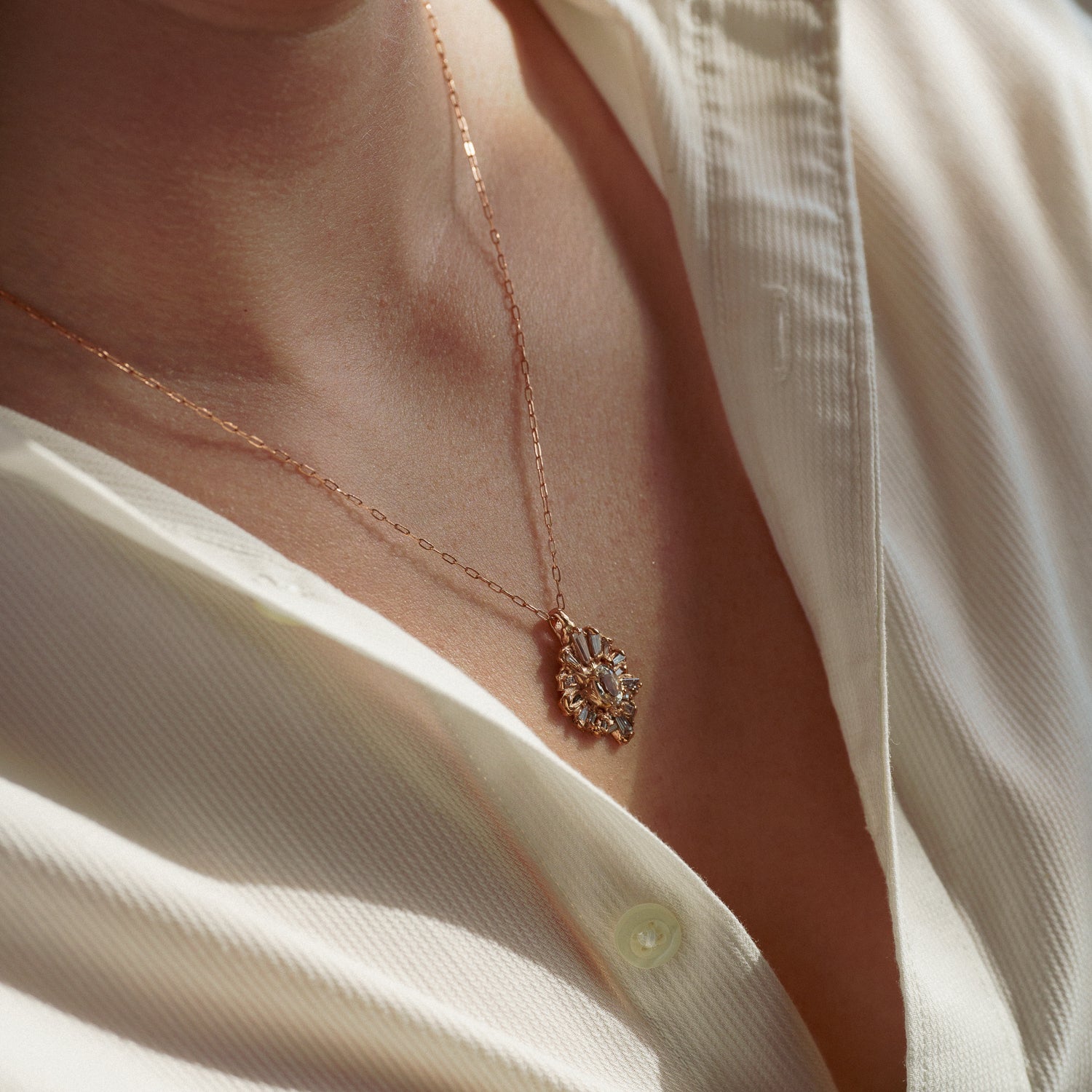 Celestial Radiance Necklace in Fairmined Rose Gold with Natural Recycled Tapered Baguette Cut Colourless Diamonds and a Natural Recycled Colour Changing Sapphire from peach to yellow