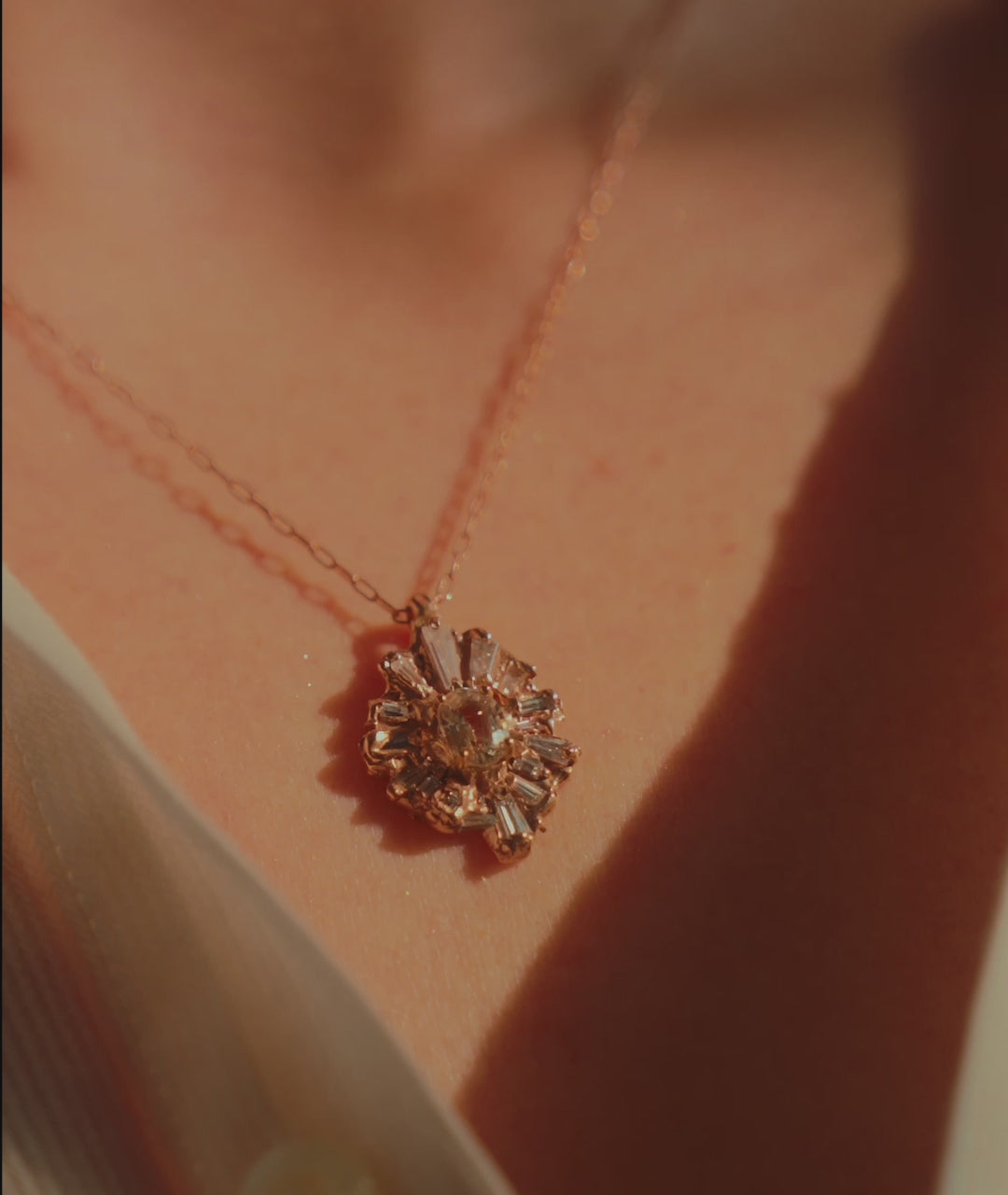 Celestial Radiance Necklace in Fairmined Rose Gold with Natural Recycled Tapered Baguette Cut Colourless Diamonds and a Natural Recycled Colour Changing Sapphire from peach to yellow