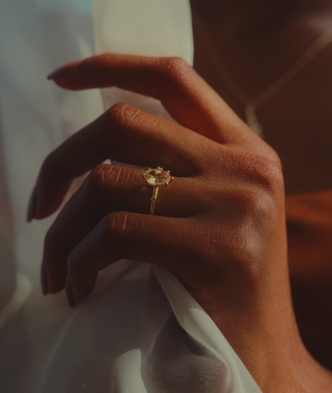 Sunrise Ring in Fairmined Yellow Gold with Portrait Cut Yellow Oval Natural Sapphire and Natural Recycled Colourless Diamonds with Leaf Motif Setting