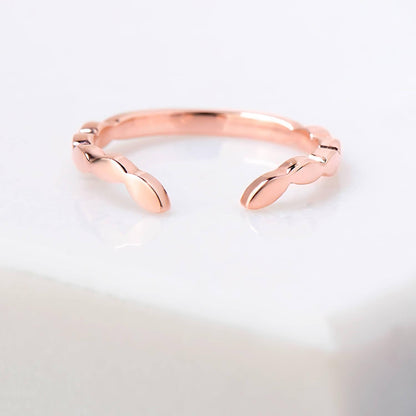 Chevron leaf profile, mirror finished 2 millimetre wide ring in 14 karat recycled rose gold.