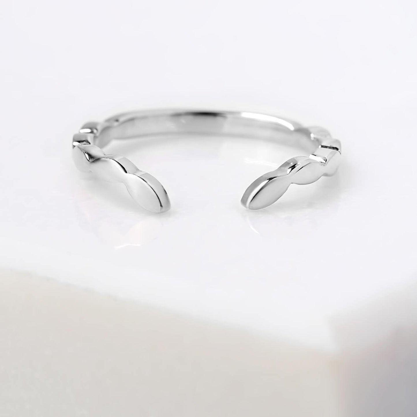Chevron leaf profile, mirror finished 2 millimetre wide ring in 14 karat recycled white gold.