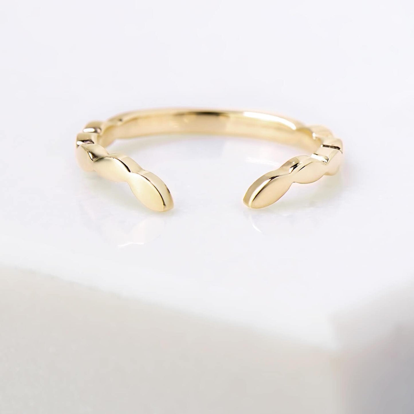 Chevron leaf profile, mirror finished 2 millimetre wide ring in 14 karat recycled yellow gold.
