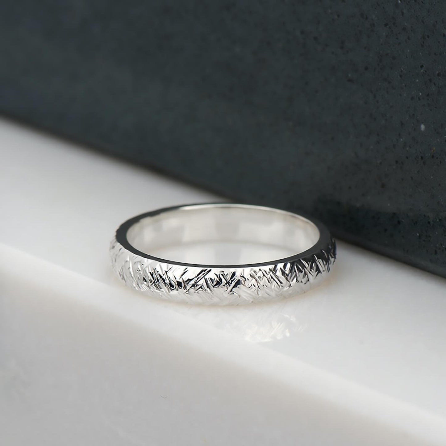 Cross hatch hammer textured and polished ring in recycled sterling silver.
