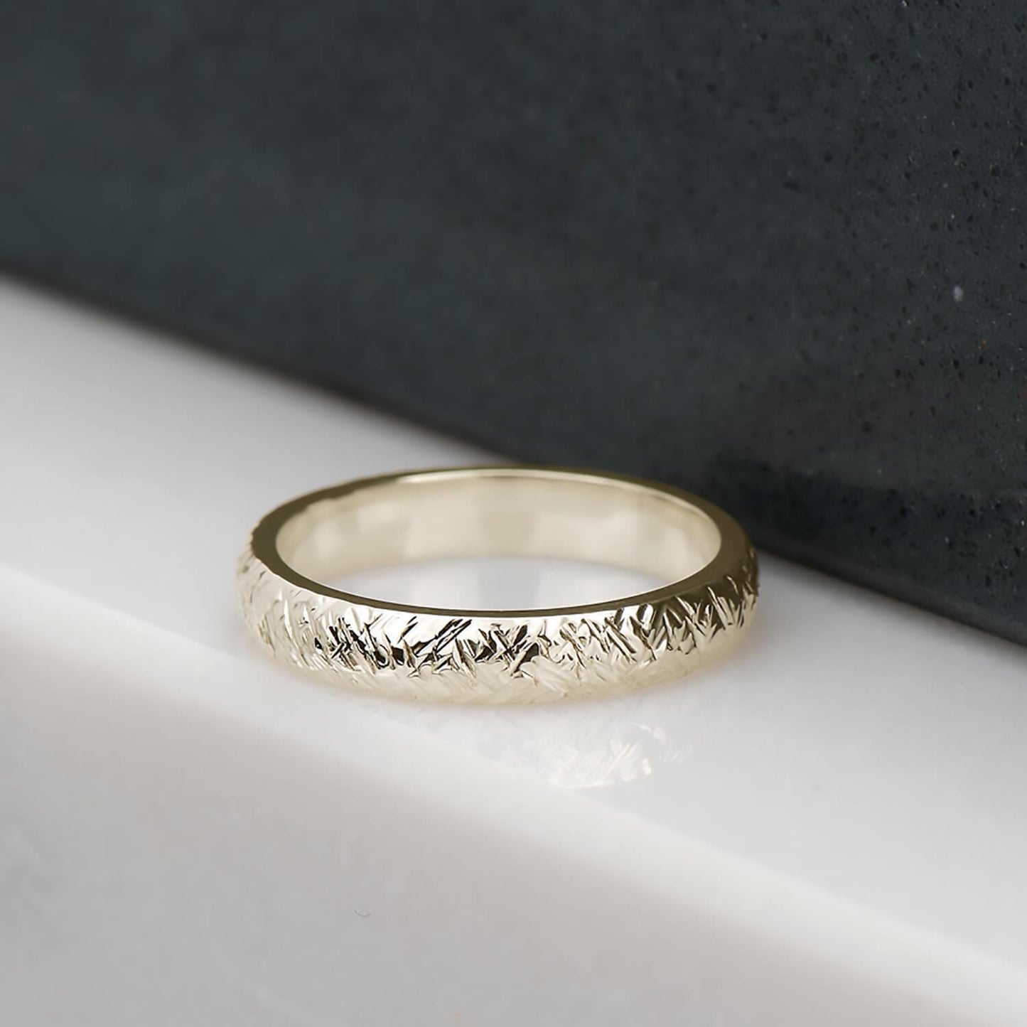 Cross hatch hammer textured and polished ring in recycled 14 karat yellow gold.