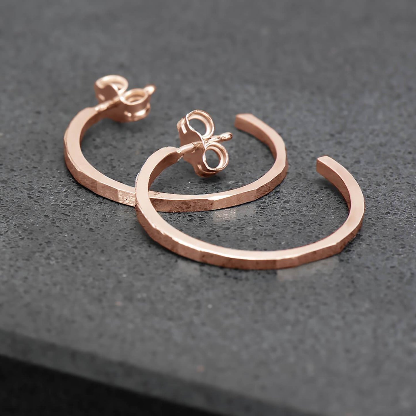 Thin, hammer finished hoop earrings in 10 karat recycled rose gold.