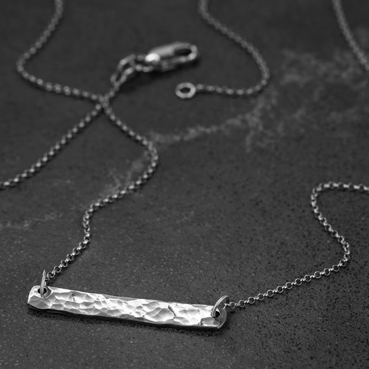 Recycled sterling silver hammer finished bar pendant brought to a polished finish with a 19" rolo chain