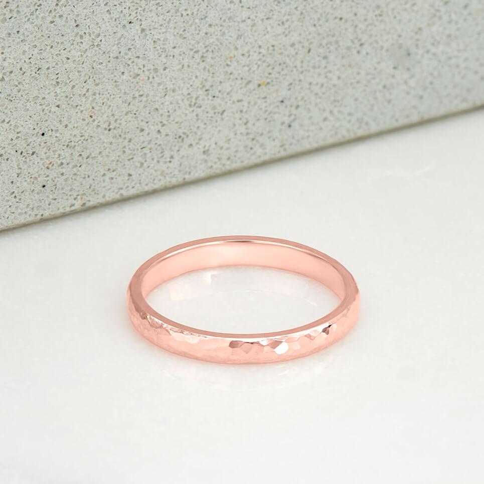 2 milimetre wide ring, polished and hammer finished, in 14 karat recycled rose gold.