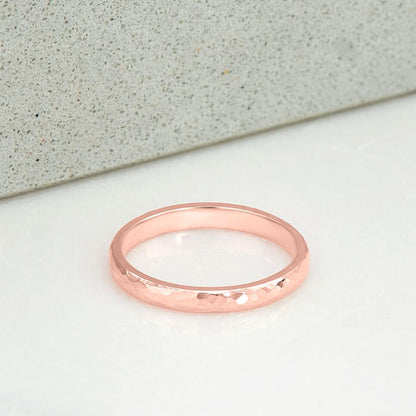 2 milimetre wide ring, polished and hammer finished, in 14 karat recycled rose gold.