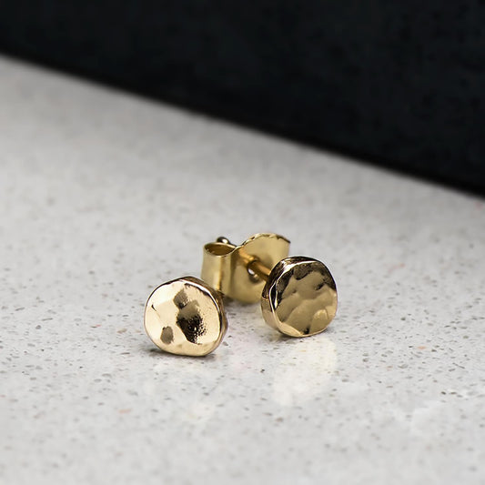 10 karat yellow gold circular hammer finished studs brought to a high polish, approximately 4.2mm in diameter