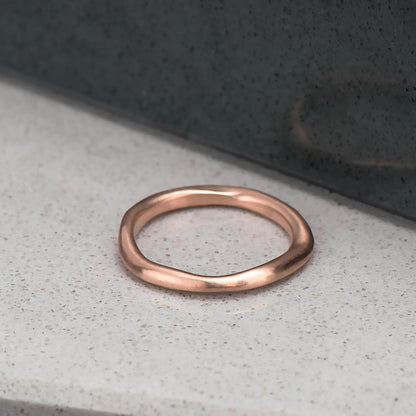 Organic, irregular shaped ring in 10 karat recycled rose gold with a satin finish.