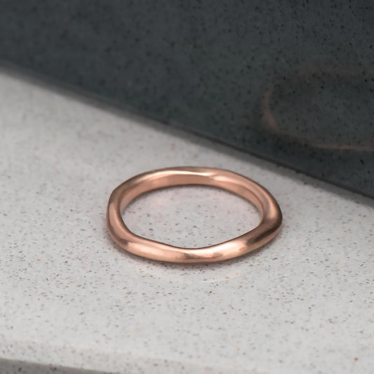 Organic, irregular shaped ring in 10 karat recycled rose gold with a satin finish.