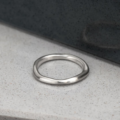 Organic, irregular shaped ring in recycled sterling silver with a satin finish.