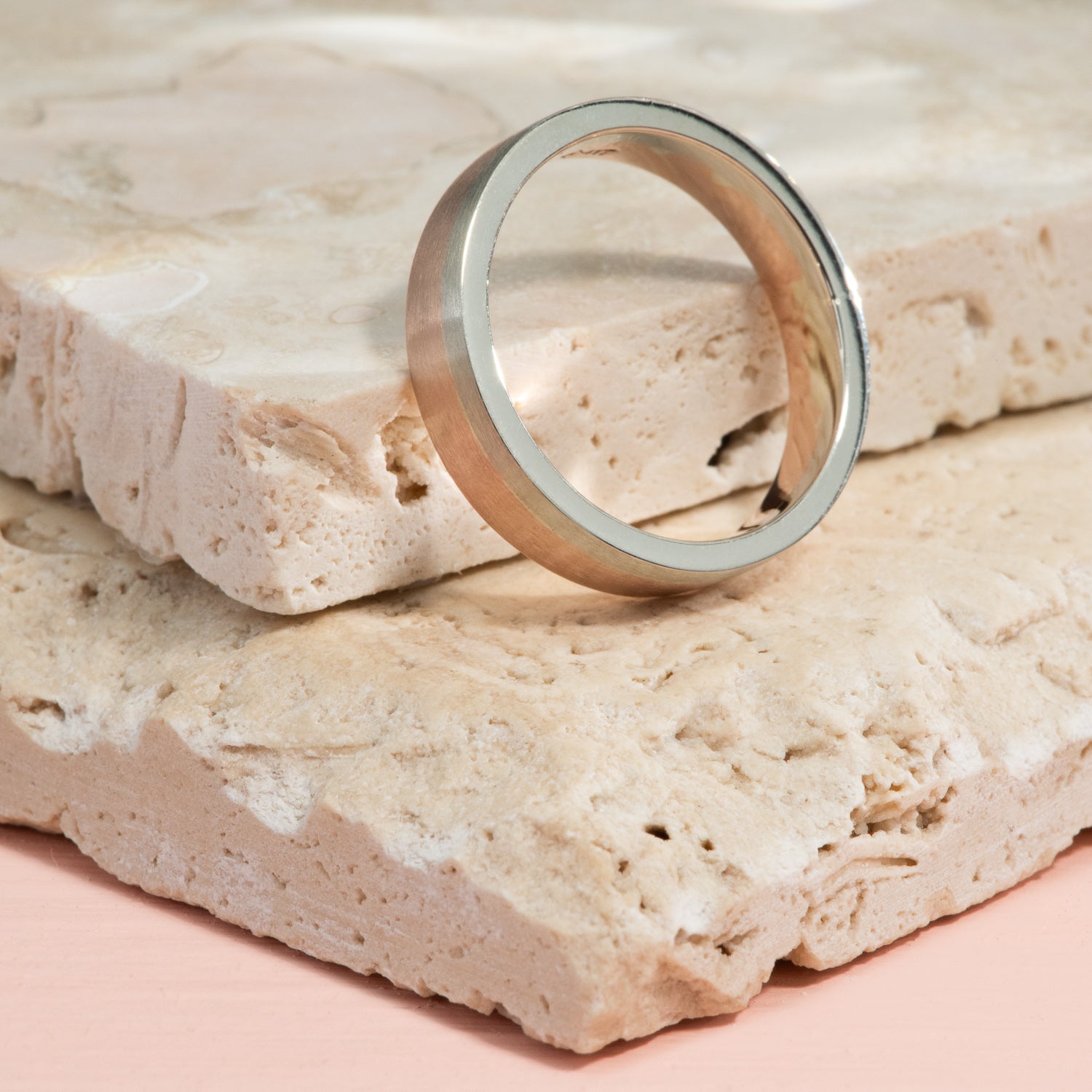 Brushed white and rose gold in clean striped all the way around a ring.