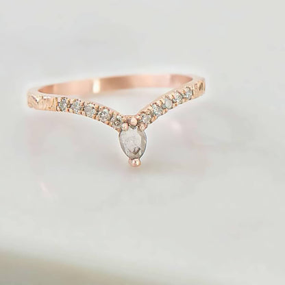 Recycled 14 karat rose gold chevron promise ring housing 0.30 carats worth of salt & pepper diamonds with a unique baroque textured band.