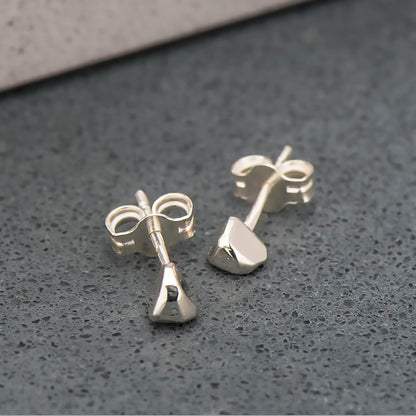 Recycled sterling silver studs, shaped like triangles and highly polished.